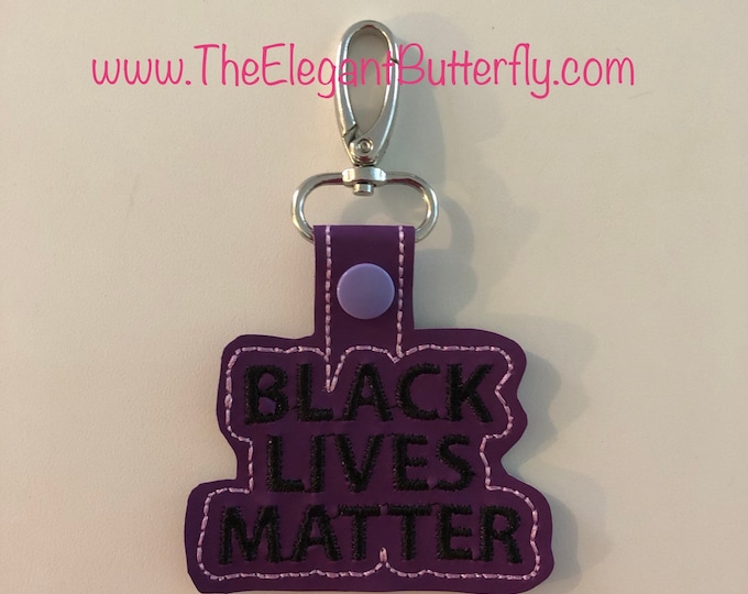 In the Hoop Snap tab Black Lives Matter BOLD FONT Embroidery File- Comes with 4x4 and also  5x7 to make 2 snap tabs at one time.