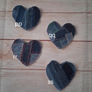 May include: Four denim heart-shaped patches with visible stitching. Each heart is made from different shades of blue denim. The patches are labeled with the letters "pp", "qq", "rr", and "ss".
