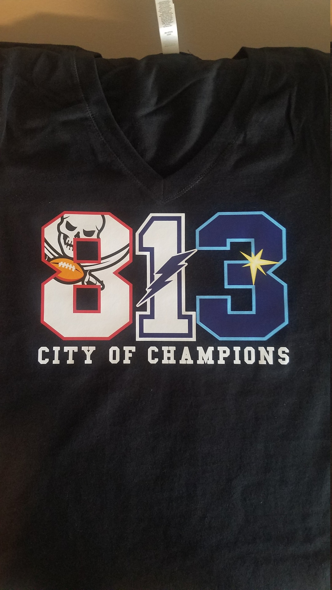 Tampa Bay Rays Tampa Bay Lightning and Tampa Bay Buccaneers 813 city of  champions shirt, hoodie, sweater, long sleeve and tank top