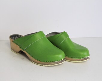 green suede clogs