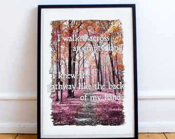 May include: Framed art print featuring a forest scene with a pathway. The image has a color palette of pinks, oranges, and browns. Text overlay reads: "I walked across an empty land. I knew the pathway like the back of my hand."