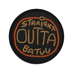 May include: A black and brown embroidered patch with an orange outline. The patch says "Straight Outta Batuu".