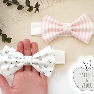 May include: Two fabric headbands with bows. One headband has a pink and white striped bow, the other has a white bow with a black bee pattern. The text "PATTERN & VIDEO" is on a gray apple.