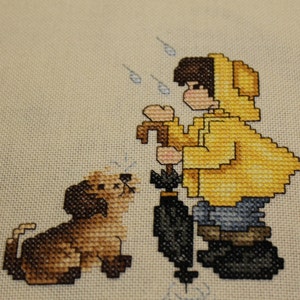 Boy and his Dog in the Rain Finished Cross Stitch Design from Stoney Creek Collection image 1