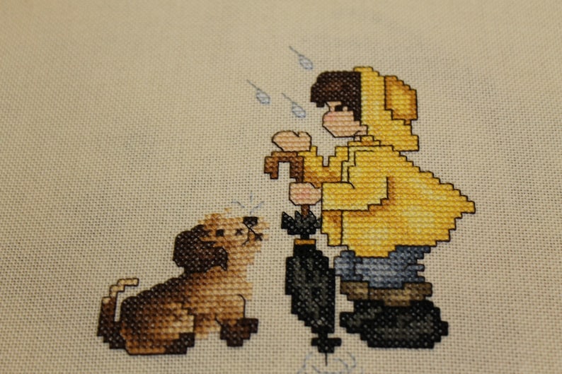 Boy and his Dog in the Rain Finished Cross Stitch Design from Stoney Creek Collection image 1