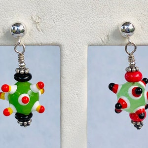 Earrings whimsical colorful green red black white spiney Lampwork beads suspended from Sterling silver ball and post earrings 1.0 inch long