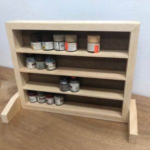 Benchtop paint storage shelf.  Narrow spacing