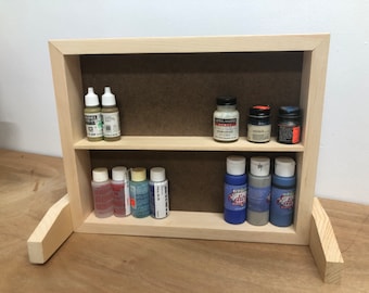 Benchtop paint storage shelf.  Wide spacing