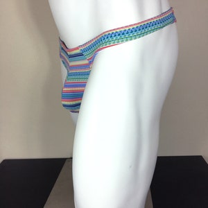 May include: A colourful striped and patterned thong underwear with a thin waistband.