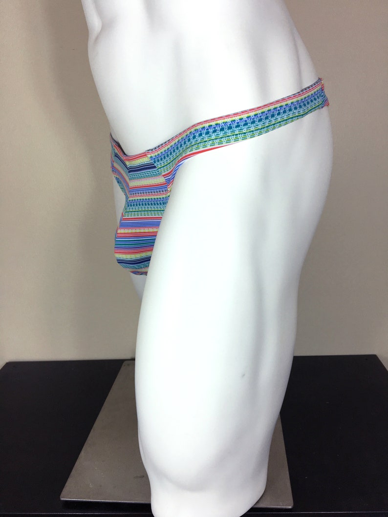 May include: A colourful striped and patterned thong underwear with a thin waistband.