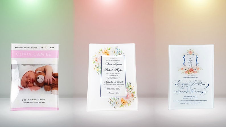 May include: Three clear acrylic plaques with floral designs and personalized text. The first plaque features a baby photo and the text "Welcome to the world - 02.24.2019 Olivia Camille". The second plaque features a wedding invitation with the text "Diana Lawson & Robert Mayer September 8, 2018". The third plaque features a save the date card with the text "Save the Date for the wedding of Emily Taylor & Conner Friday October 8, 2018".