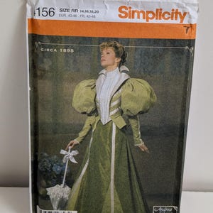 May include: A Simplicity sewing pattern envelope, number 156, for a circa 1895 dress. The package features a photograph of a person wearing a green dress with large puffed sleeves, a white high-neck bodice, and a white parasol. Size RR 14, 16, 18, 20.