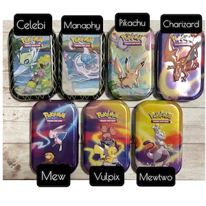 May include: Seven Pok&eacute;mon trading card game tins featuring various characters like Celebi, Manaphy, Pikachu, Charizard, Mew, Vulpix, and Mewtwo. Each tin has a unique design with the Pok&eacute;mon Trading Card Game logo.