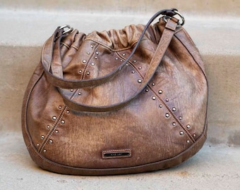 Brown bag with studded detail—chic and edgy for everyday style.