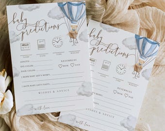 May include: Two printable baby shower game cards with a blue and white hot air balloon and a teddy bear. The cards have the text "baby predictions" and include spaces for guests to write their predictions for the baby's name, date, time, weight, eye color, hair color, and whether the baby will resemble mom or dad. The cards also include spaces for guests to write wishes and advice for the parents.