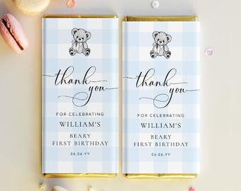 May include: Two chocolate bars with light blue gingham wrappers. Each wrapper features a teddy bear illustration, the words "thank you", and text that reads "For Celebrating William's Beary First Birthday 06.06.YY".