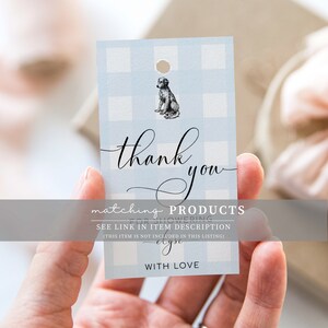 May include: A blue and white gingham thank you tag with a black and white illustration of a dog. The tag says "thank you" in cursive and "matching PRODUCTS FOR SHOWERING SEE LINK IN ITEM DESCRIPTION (THIS ITEM IS NOT INCLUDED IN THIS LISTING) WITH LOVE".