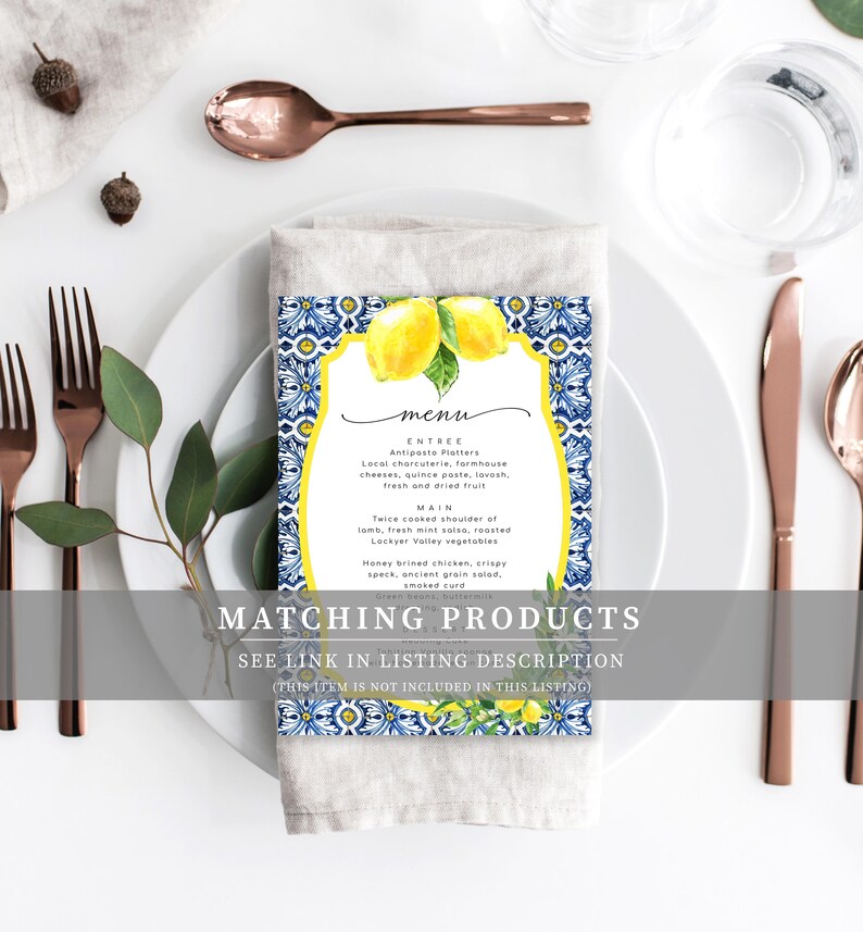 May include: A blue and white tiled menu card with a watercolor illustration of lemons. The menu text reads "menu", "Entree: Antipasto Platters", "Main: Twice cooked shoulder of lamb, fresh mint salsa, roasted Lockyer Valley vegetables", "Honey brined chicken, crispy speck, ancient grain salad, smoked cure".