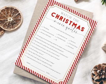 May include: A Christmas-themed game card with red and white striped borders and gold accents. The card features the text "Match the Christmas Movie Quotes" in red. The game includes a list of movie quotes to match with the correct film title.