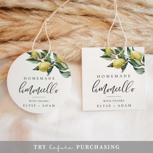 May include: Two round gift tags with a watercolor illustration of a lemon tree branch with lemons. The text on the tags reads "HOMEMADE limoncello WITH THANKS ELYSE + ADAM".
