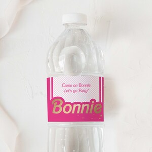 May include: A pink and white water bottle label with gold text that says "Come on Bonnie Let's go Party!" and "Bonnie".