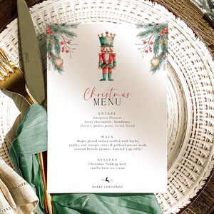 May include: A Christmas menu card with a watercolor illustration of a nutcracker soldier, fir branches, and ornaments. The menu includes entree, main course, and dessert options. The words "Christmas Menu" and "Merry Christmas" are also displayed.