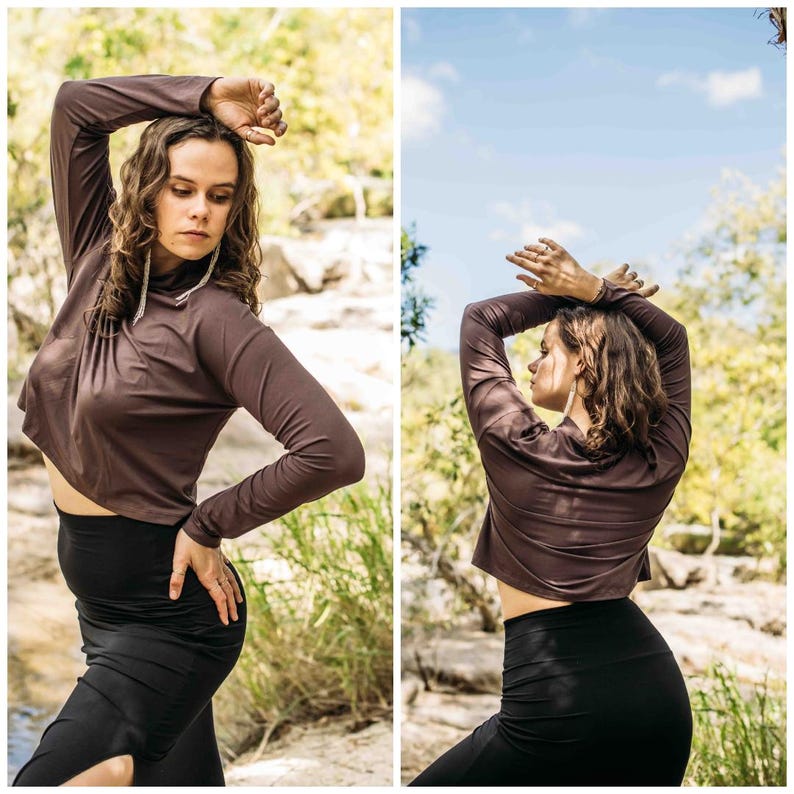 May include: A two-panel image shows a person wearing a brown long-sleeved crop top and black leggings. The top has a high neckline and the leggings are high-waisted. The background is a natural outdoor setting with trees and foliage.