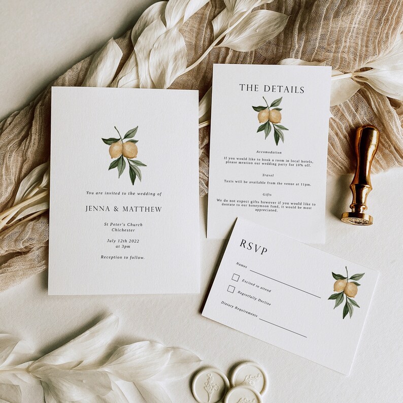 May include: A wedding invitation suite with a lemon illustration. The invitation card reads "You are invited to the wedding of Jenna & Matthew" with the date and location of the ceremony. The details card includes information about accommodation, travel, and gifts. The RSVP card has a checkbox for attending or declining and a space for dietary requirements.