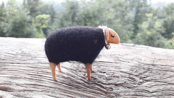 wooden sheep with wool