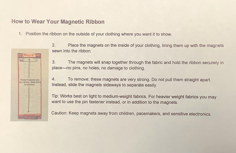 May include: Instructions on how to wear a magnetic ribbon. The text explains how to position the ribbon, align the magnets, and remove the ribbon. A small package with a ribbon and magnets is shown.