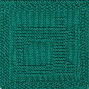 May include: A teal blue knitted dishcloth with a square pattern. The dishcloth has a woven design with a central square.