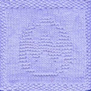 May include: A close-up of a lavender knitted dishcloth with a geometric pattern.