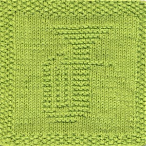 May include: A green knitted dishcloth with a woven pattern.