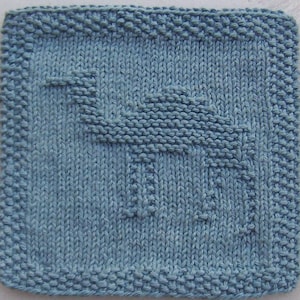 May include: A blue knitted dishcloth with a simple geometric design. The design is created by using knit and purl stitches to create a raised pattern.