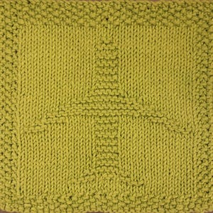 May include: A green knitted dishcloth with a woven pattern.