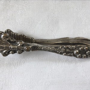 Silver Plate Nut Cracker with Ornate Fleur de Lis Design.  Antique Silver Plated Nut Cracker.