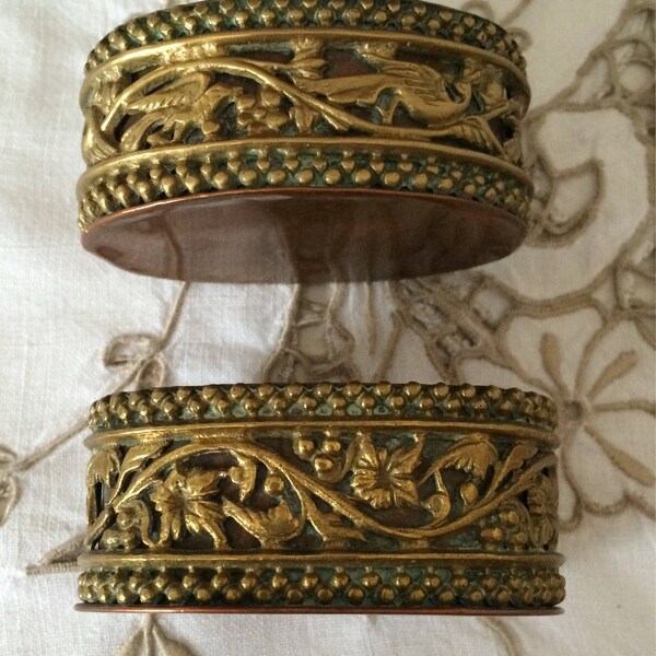 A Pair of Open Salt Dishes/Cellars.  Brass and Copper with Griffin and Floral Design.  Finished with Beaded Edging.