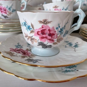 Aynsley Floral Embossed English Trio. Crocus Shaped Fine Bone China Teacup, Saucer and Side Plate with Scalloped Edges with Gold Trim.