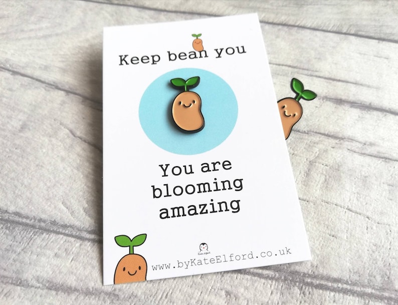 May include: White card with the text "Keep bean you, you are blooming amazing" and a cartoon bean sprout with a smiling face. The card has a website address at the bottom: www.byKateElford.co.uk
