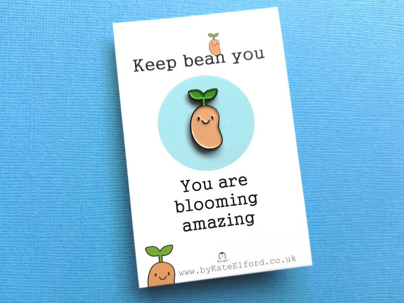 May include: A white card with a green and brown bean sprout illustration and the text "Keep bean you, you are blooming amazing" and a website address at the bottom.