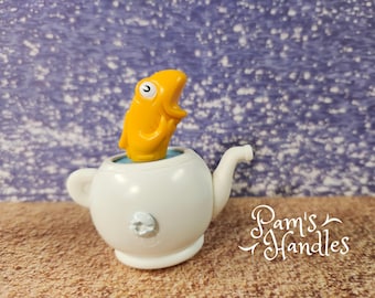 Poisson dans une théière simple bouton 1d