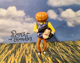 Mr. Peterson, Tête de citrouille à bouton unique