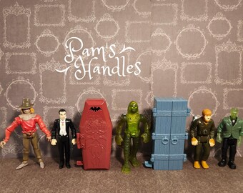 Monstres classiques et 2 cercueils, lot de 7 boutons