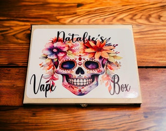 May include: A wooden box with a colorful sugar skull design and the text "Natalie's Vape Box".