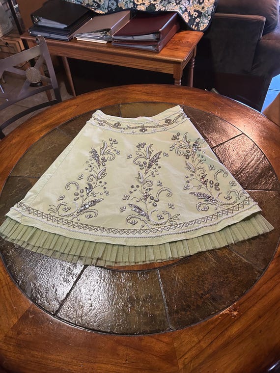 Woman's heavily beaded and sequined size 10 light green skirt