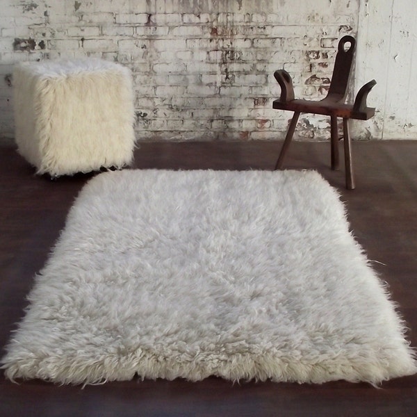 Ultra-thick and plush 4' x 6' flokati shag rug. Long 4"+ pile. 100% wool no synthetics! Like walking on a cloud!