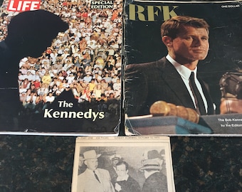 May include: A black and white newspaper clipping with the headline "The Instant It Happened - 1963 Jack Ruby's Fatal Shot at Oswald". The article describes the events of the assassination of President John F. Kennedy and the subsequent shooting of Lee Harvey Oswald by Jack Ruby.