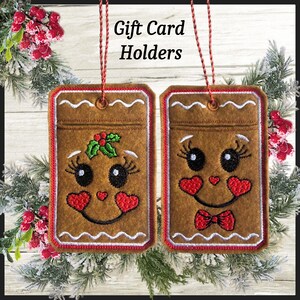 May include: Two brown felt gift card holders with gingerbread person faces, red trim, and white accents. One has a holly sprig, the other a bow tie. The text "Gift Card Holders" is above them.