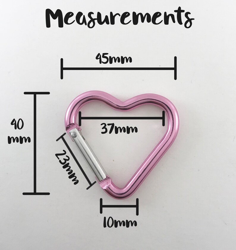 May include: Pink heart-shaped carabiner with measurements: 45mm, 40mm, 37mm, 23mm, and 10mm.