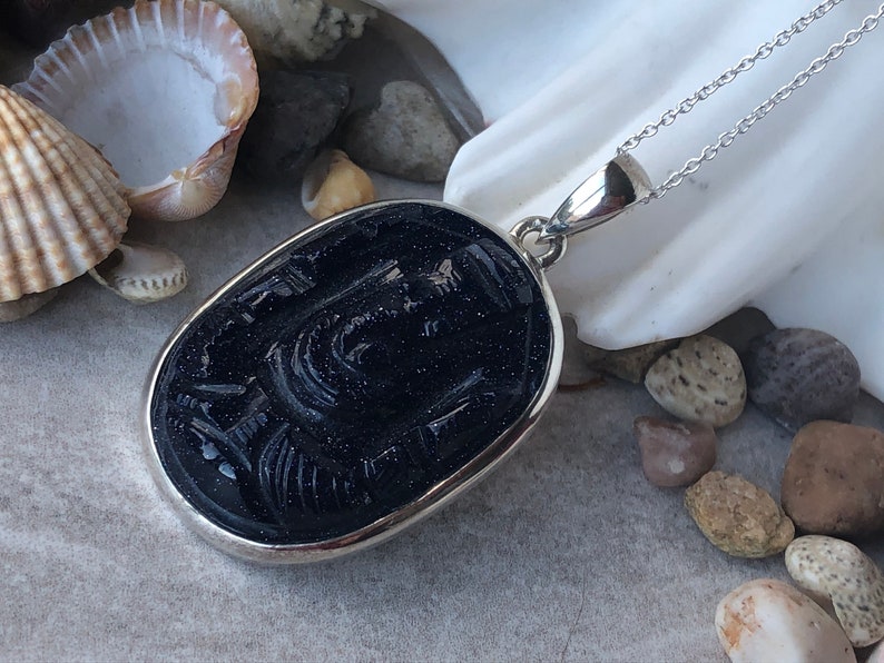 The God of all Beginings Blue Goldstone Carved Ganesha Elephant Head design 925 Sterling Silver Pendant.